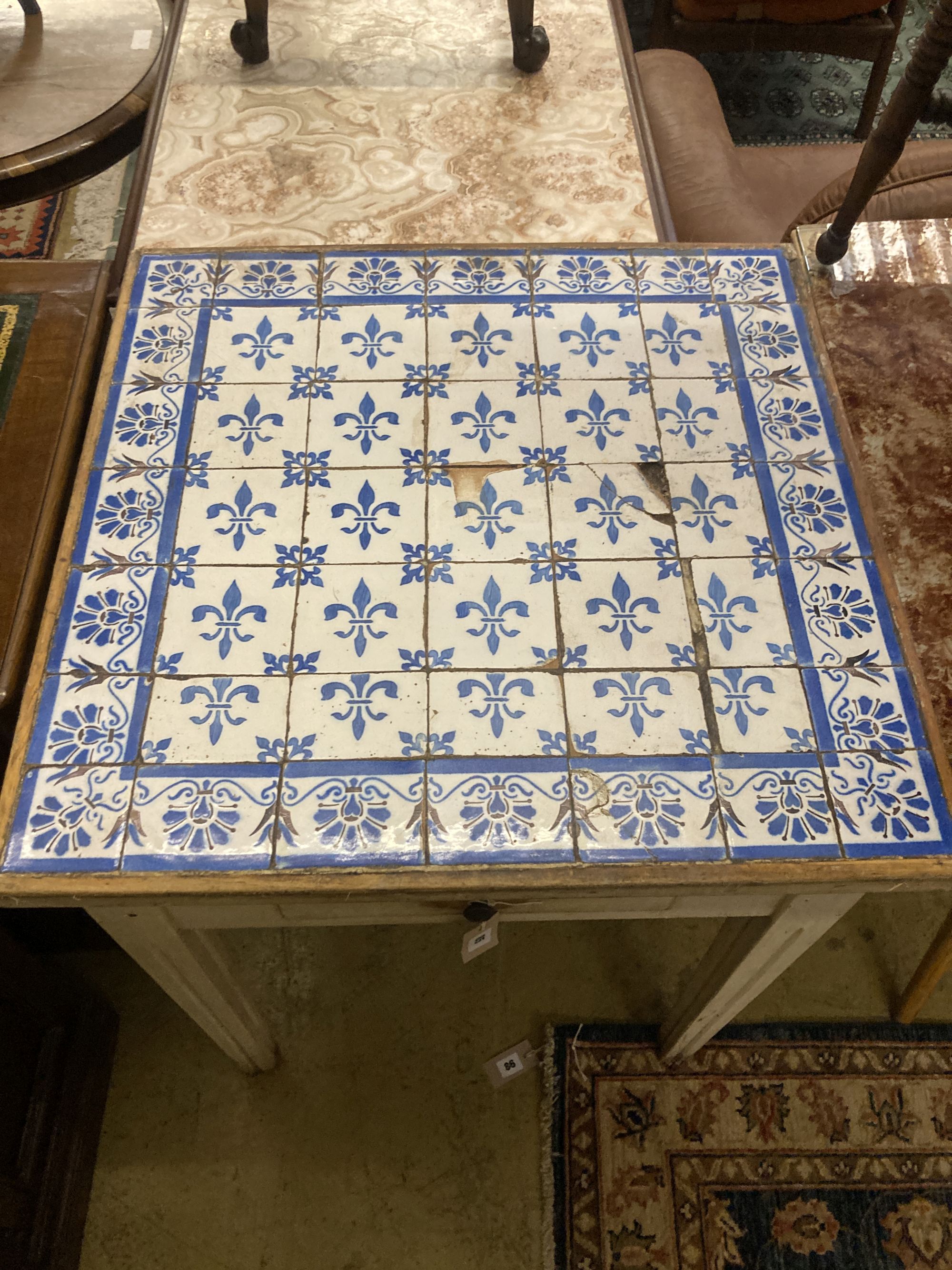 A Continental painted tile top table, width 71cm depth 70cm height 78cm